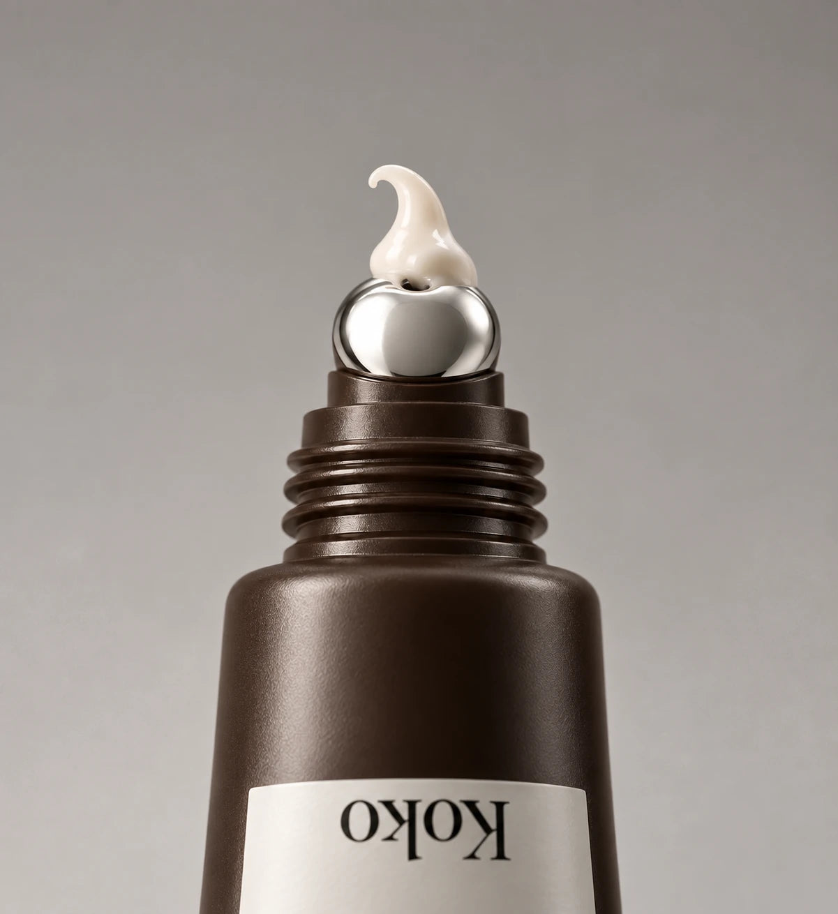 A small amount of eye cream on the silver applicator tip