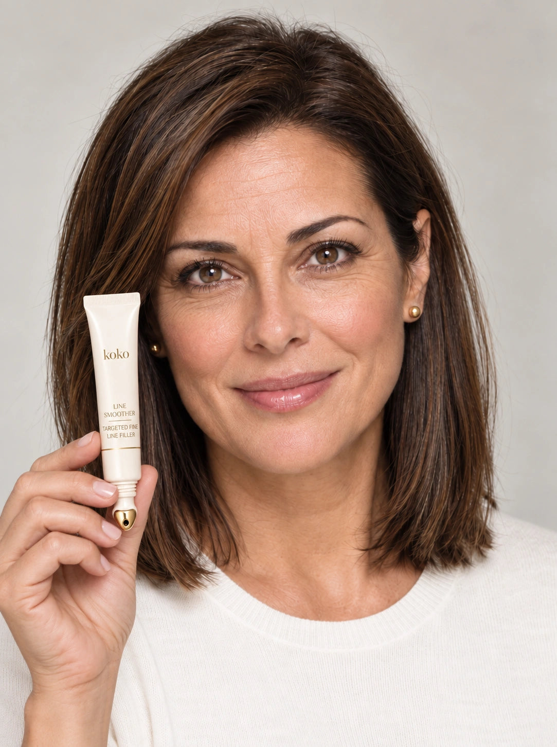 Illustrative portrait with fine lines, holding Koko primer