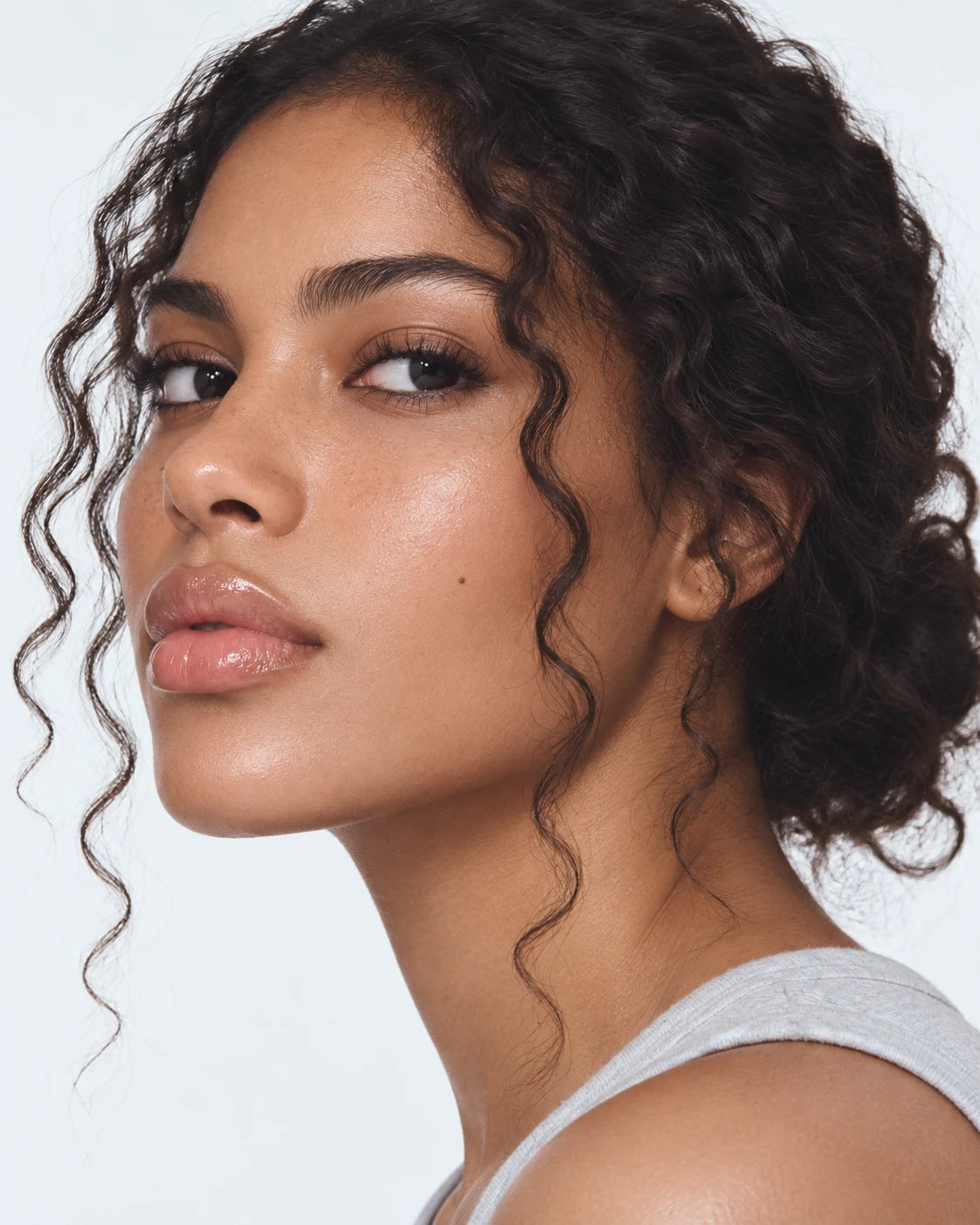 Portrait of a woman with radiant, dewy-looking skin